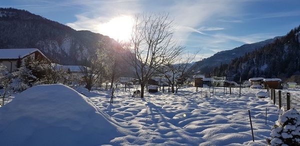 Scenic view of snow covered mountains against sky