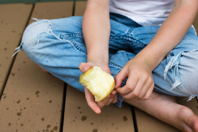 Midsection of woman holding ice cream