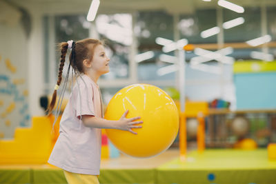 Girl playing with ball