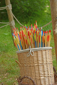 Close-up of wicker basket on grass