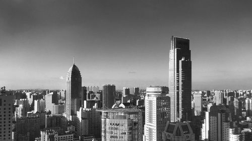 Skyscrapers in city against clear sky