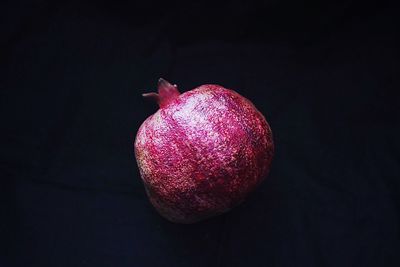 High angle view of apple on table against black background