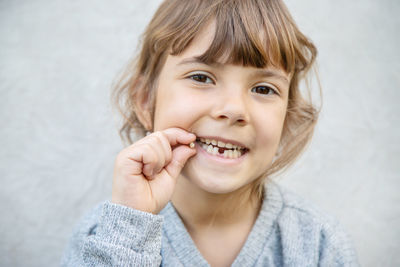 Portrait of smiling girl with broken tooth