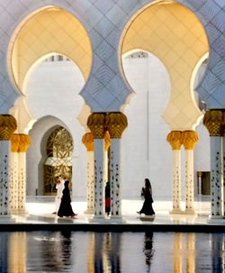 Reflection of woman on water in building