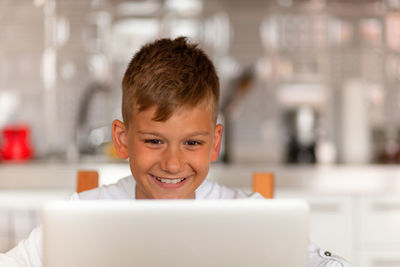 Portrait of boy using mobile phone