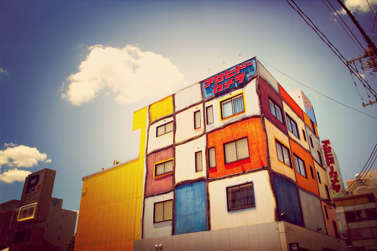 architecture, building exterior, built structure, low angle view, sky, residential building, window, residential structure, building, blue, house, city, power line, cloud, day, outdoors, no people, cable, cloud - sky, sunlight