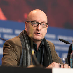 Portrait of man sitting in eyeglasses