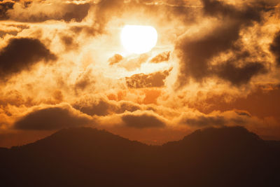 Low angle view of dramatic sky during sunset