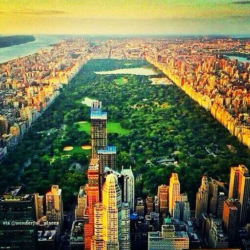 architecture, city, built structure, high angle view, building exterior, cityscape, aerial view, water, transportation, skyscraper, sea, modern, city life, river, sky, bridge - man made structure, outdoors, office building, road, crowded