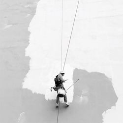 Low angle view of man climbing on mountain