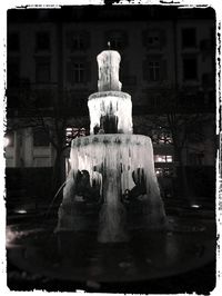 Statue in front of building