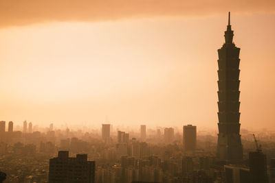 View of cityscape against sky during sunset