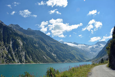 Scenic view of lake and mountains against sky