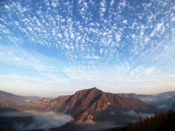 View of mountain range against cloudy sky
