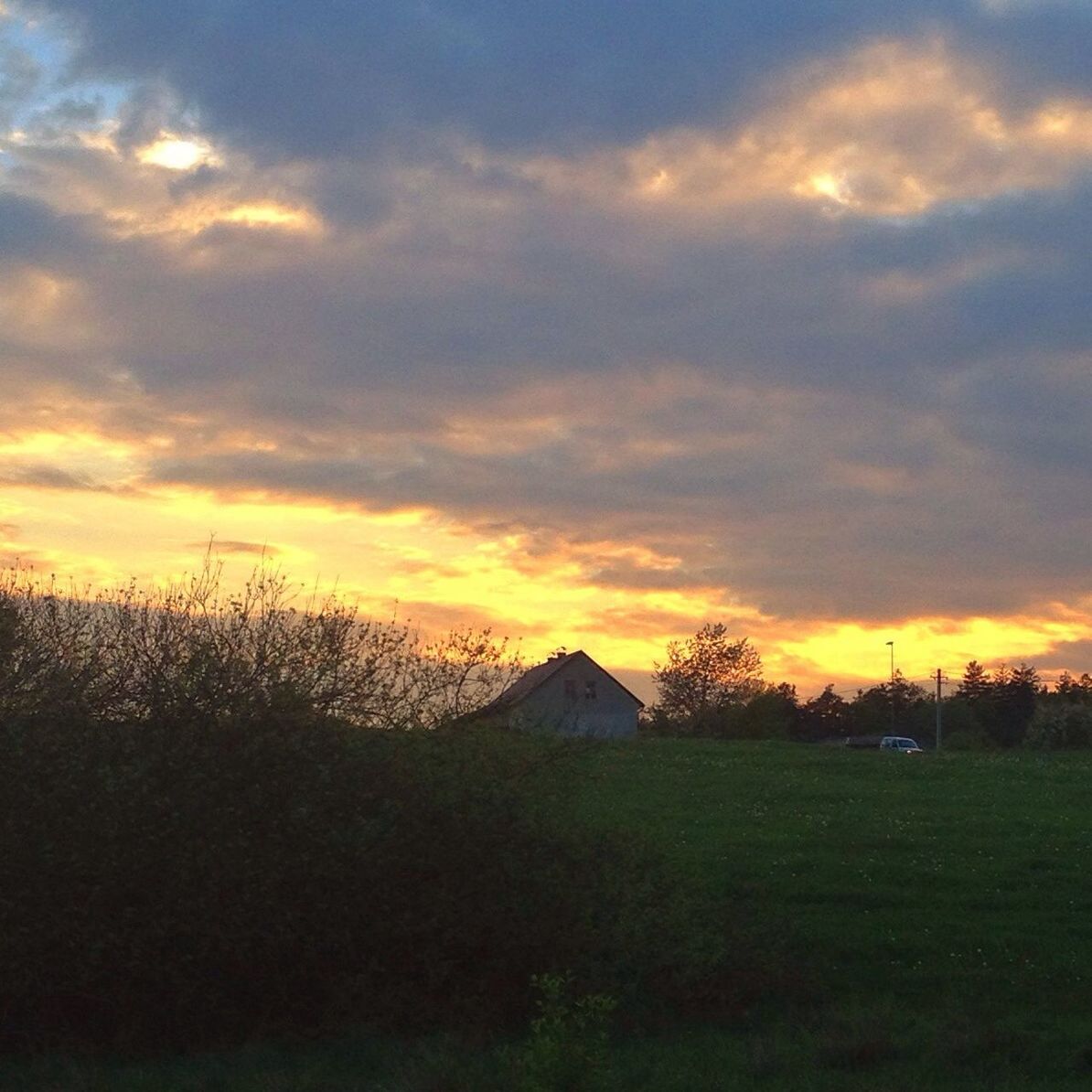 sunset, sky, orange color, architecture, cloud - sky, building exterior, built structure, landscape, field, tree, scenics, beauty in nature, tranquil scene, tranquility, grass, house, nature, silhouette, cloud, idyllic