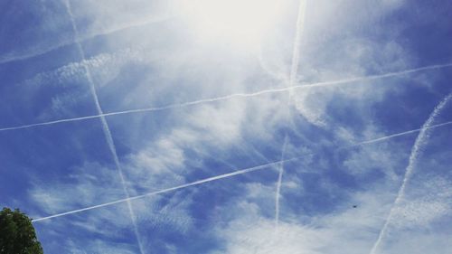 Low angle view of vapor trail in blue sky