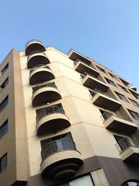 Low angle view of building against clear blue sky