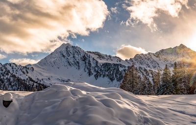 Scenic view of snowcapped mountains against sky