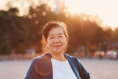 Portrait of senior woman standing outdoors