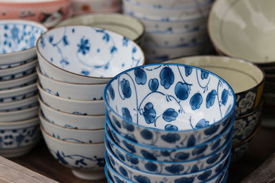 Close-up of stacked bowls on table in store