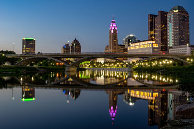 Reflection of buildings in city at night