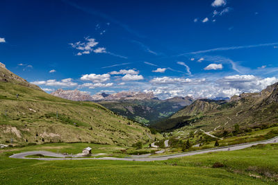 Scenic view of landscape against blue sky