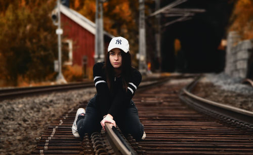 Full length of man standing on railroad track