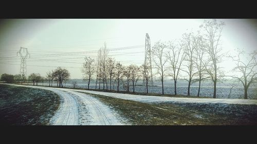 Road passing through snow covered landscape