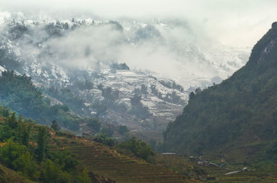 Snow covers the mountains, road and roofs during the first snowfall in sapa, lao cai, vietnam