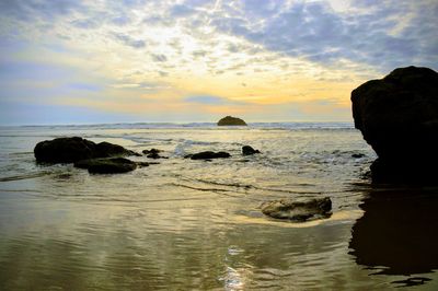 Scenic view of sea against sky during sunset