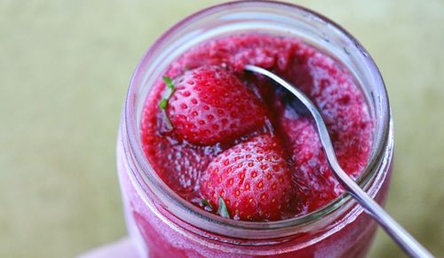 High angle view of strawberries in glass jar