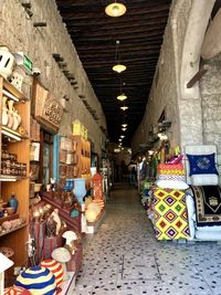 Illuminated lanterns hanging at market stall