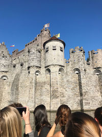 Group of people in front of historical building