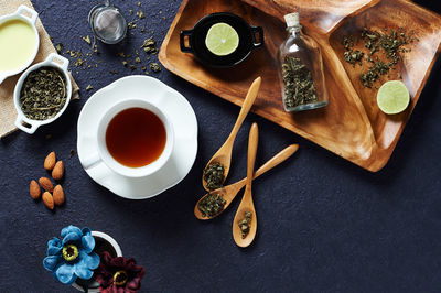 Tea cup and ingredients on table