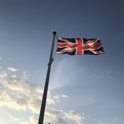 Low angle view of flag against sky