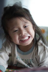 Close-up of girl at home