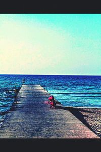 Scenic view of calm sea against clear sky