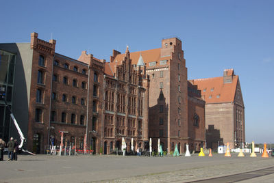 Multi colored art decoration on street against historic building in city
