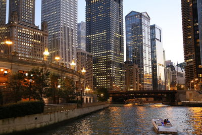 Buildings in city at dusk