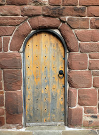 Closed door of brick wall