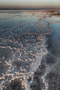 Scenic view of sea against sky during winter