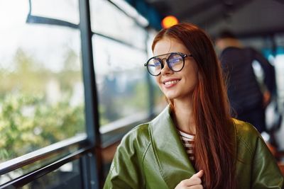 Portrait of young woman wearing sunglasses