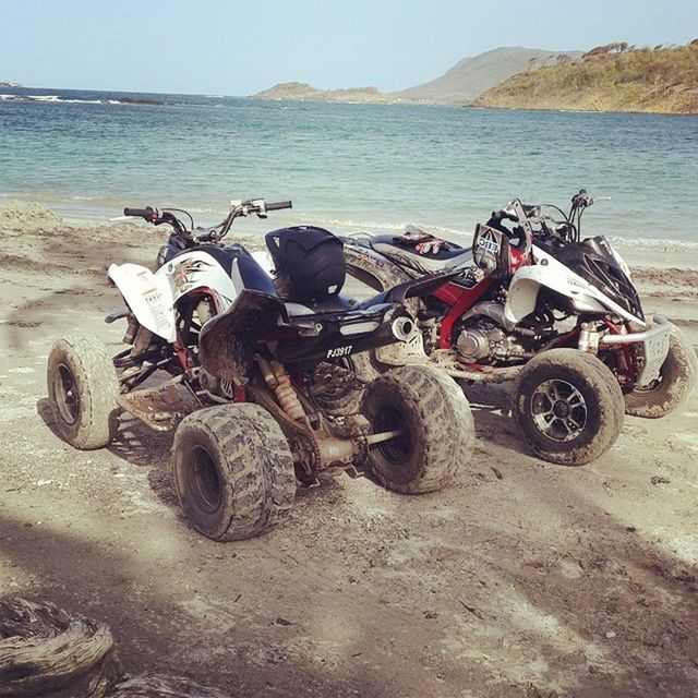 transportation, mode of transport, beach, sea, abandoned, land vehicle, water, sand, shore, tranquility, obsolete, stationary, horizon over water, bicycle, old, sky, tranquil scene, day, nature, damaged