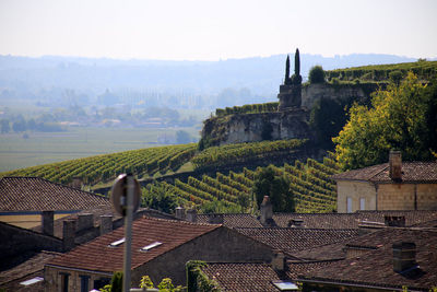 Old town by buildings in city against sky