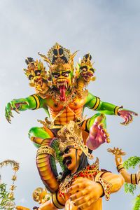 Low angle view of statue against sky