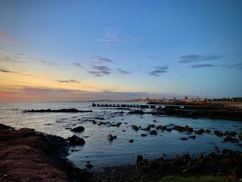 Scenic view of sea against sky at sunset