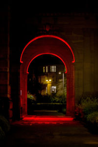 Illuminated red building at night