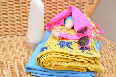 High angle view of multi colored clothing and personal accessories on table