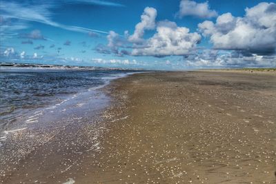 Scenic view of beach against sky