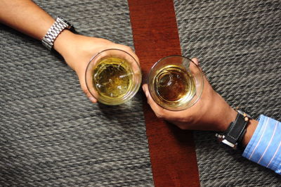 Close-up of hand holding drink